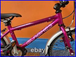 Islabikes cnocc16 in pink kids bike with mudguards and kickstand